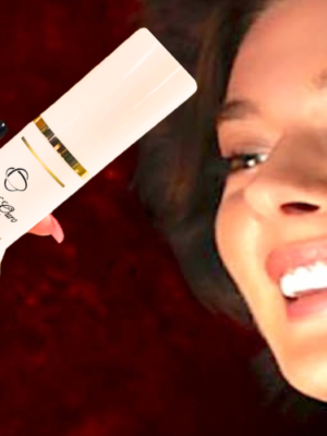 girl holding Fio de Ouro Eternaglow Elixir bottle best vitamin c serum for face